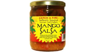 Bright tropical mango salsa made with fresh mango, peppers, onions, cilantro, and spicy heat served in a colorful bowl with a tropical island vibe.