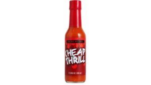Cheap Thrill Cayenne Hot Sauce bottle on a white background