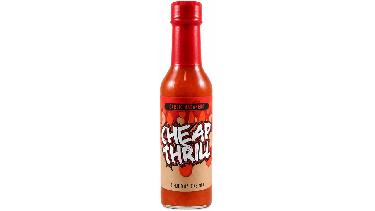 Cheap Thrill Garlic Habanero Hot Sauce bottle with red cap and spicy garlic habanero sauce