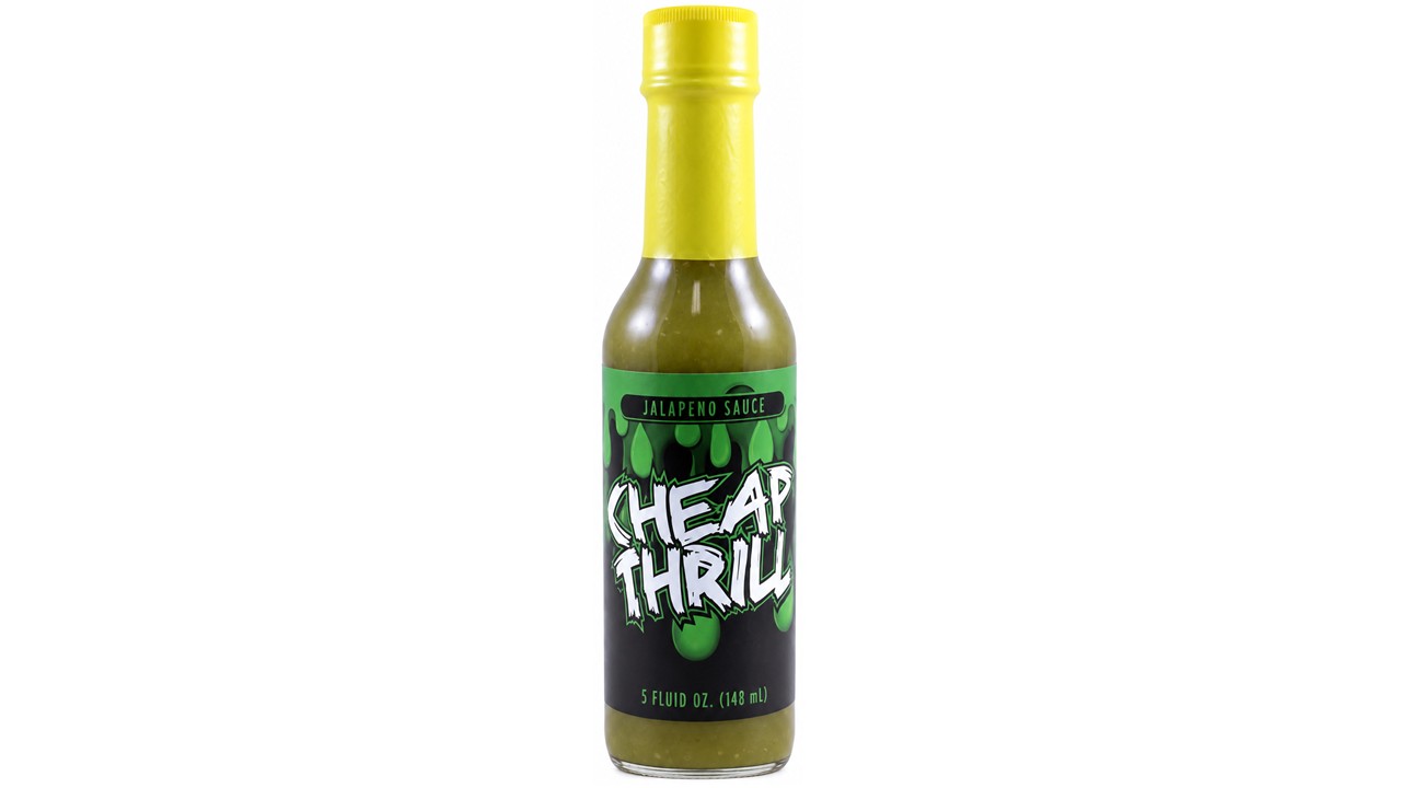 Cheap Thrill Jalapeño Hot Sauce bottle with yellow cap and green jalapeño pepper sauce