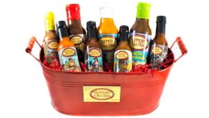 Peppers of Key West 11 pack hot sauce collection featuring a variety of tropical and spicy flavors in assorted bottles