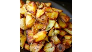 Crispy Dr. Assburn’s spiced roasted potatoes served with bold seasoning and smoky hot sauce flavor