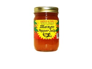 Catch a Fire’s Mango Pepper Jelly served with grilled meats, cream cheese, crackers, seafood, and tropical backyard BBQ appetizers