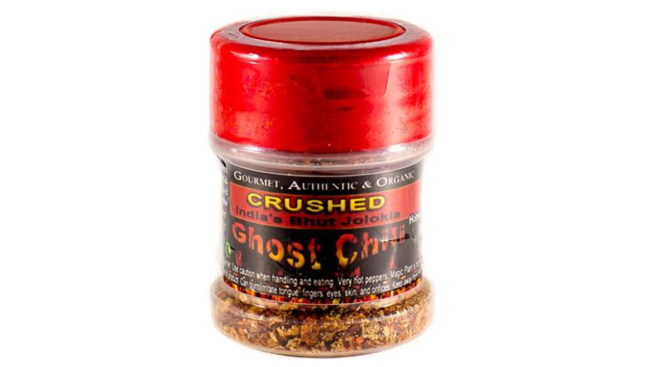 Magic Plant Farm’s Ghost Pepper Flakes jar filled with crushed ghost peppers, delivering extreme heat and bold flavor for spicy foods.
