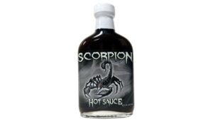 Trinidad Scorpion hot sauce bottle with fiery red chili peppers extreme heat sauce