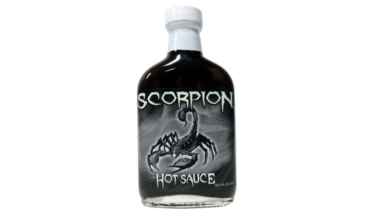 Trinidad Scorpion hot sauce bottle with fiery red chili peppers extreme heat sauce