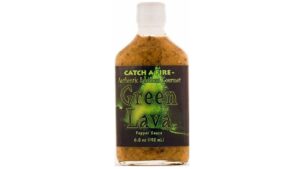 Catch a Fire Green Lava Hot Sauce with green chili peppers showing vibrant mild to medium heat hot sauce for tacos and seafood