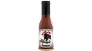 Bottle of Hog’s Ass Hot Barbeque Sauce with smoky spicy barbecue flavor and bold backyard grilling heat
