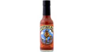 Mountain Man Garlic Pepper Sauce bottle with bold garlic flavor and smoky pepper heat from Peppers of Key West