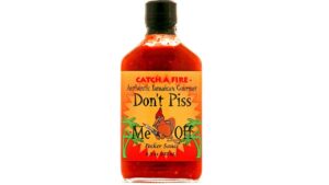 Catch a Fire Don’t Piss Me Off Pecker Hot Sauce bottle featuring bold Caribbean-style hot peppers, tropical spices, and intense island heat