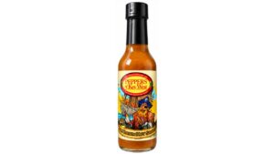 Peppers of Key West Rum Raisin Hot Sauce bottle featuring a tropical pirate label on a clean white background.