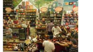 Original Peppers of Key West store interior with hot sauces and customers at the tasting bar